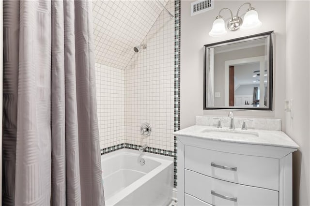 bathroom featuring shower / tub combo with curtain and vanity