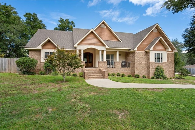 craftsman-style house with a front yard and a porch