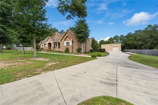 view of front facade featuring a front yard and a garage