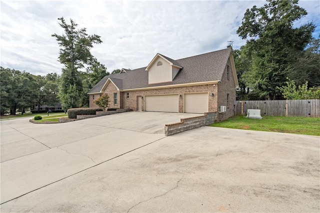 view of front facade with a garage and a front yard