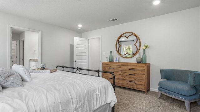 10570 Relic Rd S, Mobile, AL 36608 - bedroom with light carpet, recessed lighting, and ensuite bath