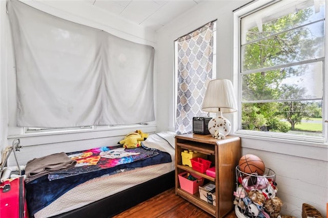 bedroom with hardwood / wood-style floors