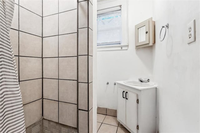 bathroom with vanity, a shower with curtain, and tile patterned floors