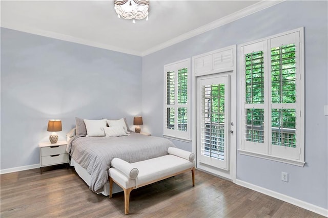 bedroom with access to outside, dark wood-type flooring, and ornamental molding