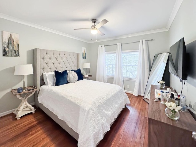 bedroom with baseboards, dark wood-style floors, ornamental molding, and ceiling fan