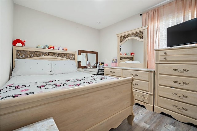 bedroom with light wood-type flooring