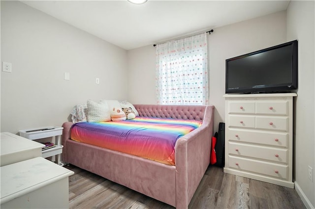 bedroom featuring wood finished floors