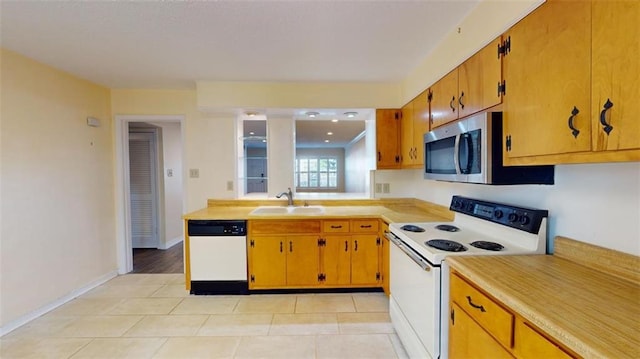 4009 Old Shell Rd Unit D13, Mobile, AL 36608 - kitchen with light tile patterned flooring, white appliances, and sink