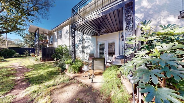 4009 Old Shell Rd Unit D13, Mobile, AL 36608 - view of yard with ceiling fan, a balcony, and french doors