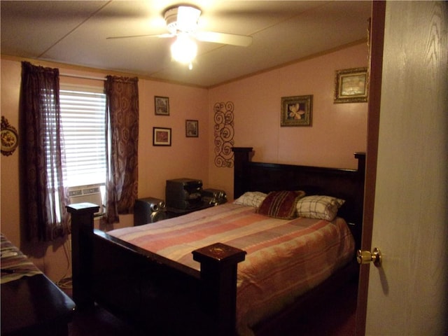 bedroom featuring vaulted ceiling, cooling unit, and ceiling fan