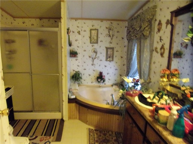 bathroom featuring independent shower and bath and vanity