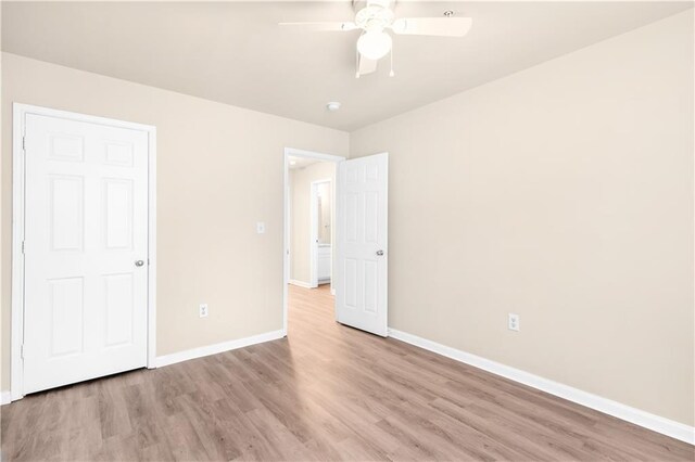 unfurnished bedroom featuring light hardwood / wood-style flooring and ceiling fan