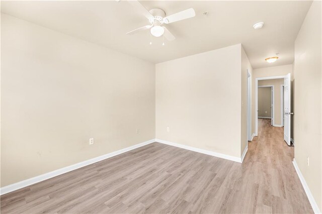 spare room with ceiling fan and light hardwood / wood-style floors