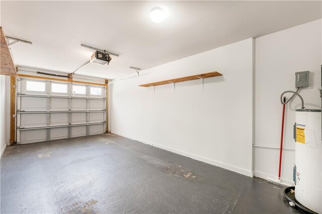 garage with a garage door opener and water heater