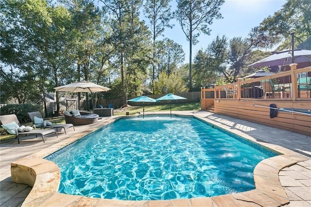 view of swimming pool with a patio area