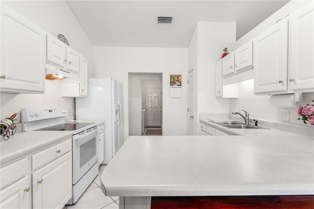 kitchen with light tile patterned floors, sink, white cabinets, and white appliances