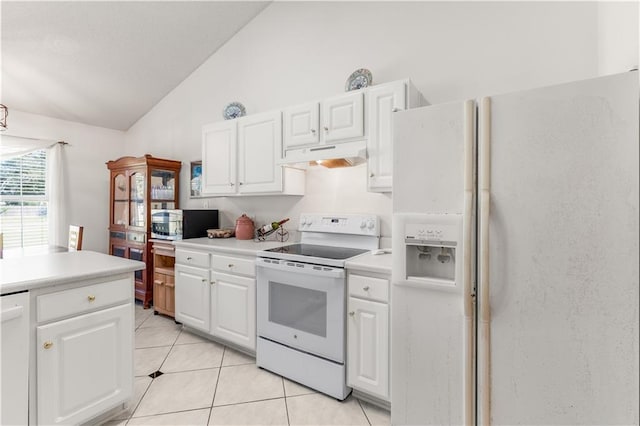 kitchen with lofted ceiling, white cabinets, light tile patterned flooring, and white appliances