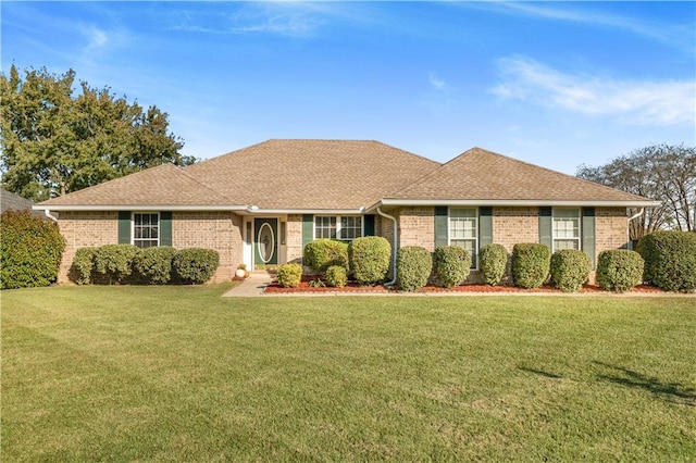 ranch-style home featuring a front yard