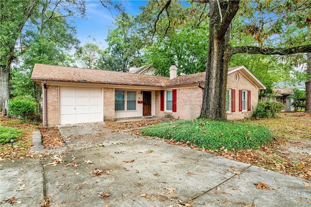 ranch-style house featuring a garage