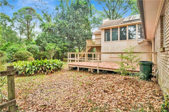 view of yard with a wooden deck