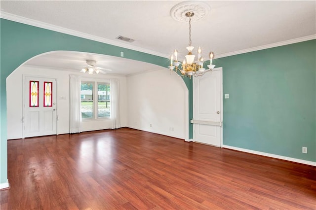 spare room with dark hardwood / wood-style flooring, ceiling fan with notable chandelier, and crown molding