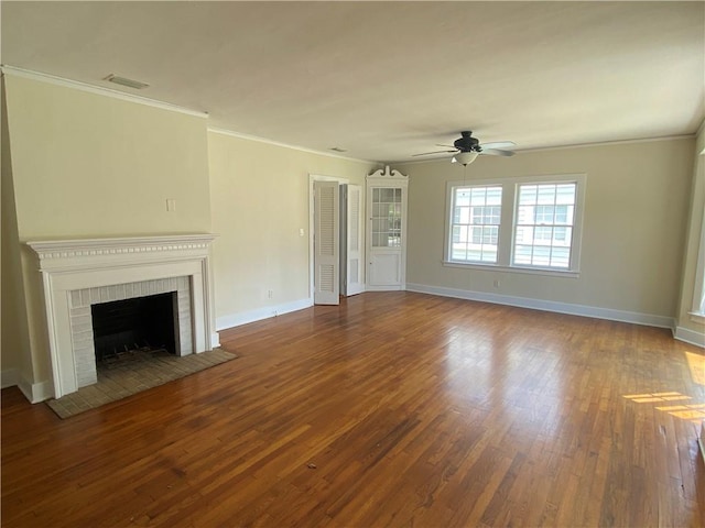 unfurnished living room with ornamental molding, a fireplace, wood-type flooring, and ceiling fan