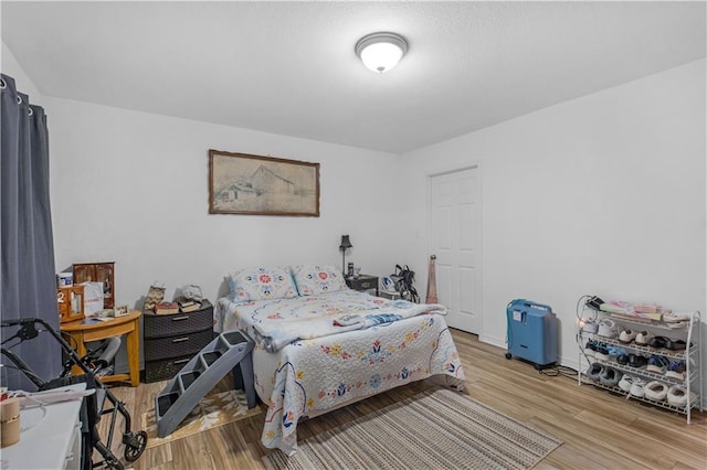 bedroom featuring light wood-style floors