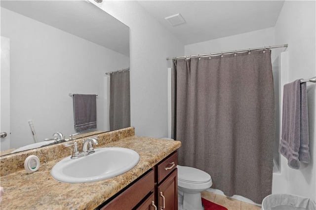 bathroom with toilet, vanity, a shower with shower curtain, and tile patterned floors