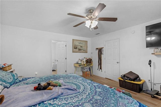 bedroom featuring ceiling fan and wood finished floors