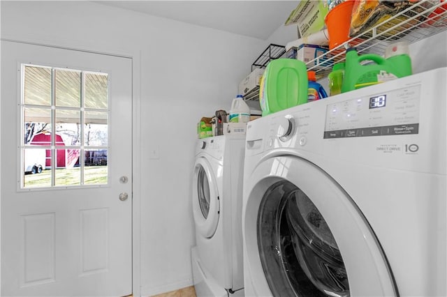 washroom featuring laundry area and washer and clothes dryer