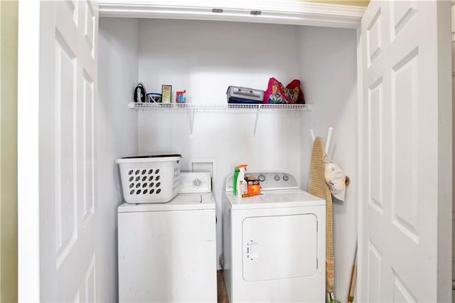 washroom featuring independent washer and dryer