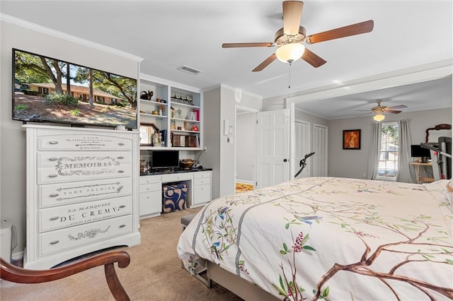 bedroom featuring light carpet, ceiling fan, and crown molding