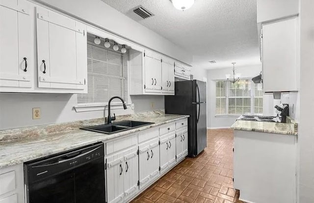 kitchen featuring white cabinetry, black appliances, and sink