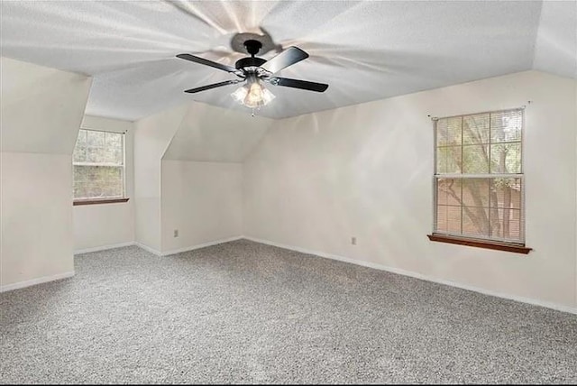 bonus room featuring carpet, ceiling fan, and lofted ceiling