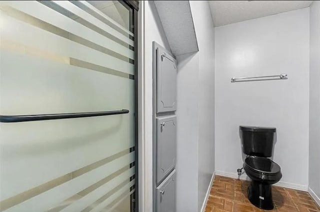 2751 Hamilton Creek Dr W, Mobile, AL 36695 - bathroom featuring toilet, baseboards, and brick floor