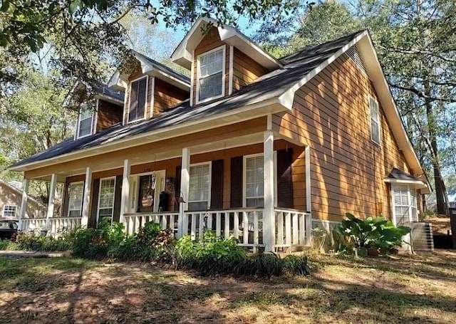 view of property exterior with covered porch