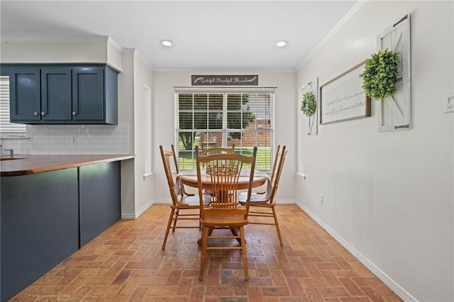 3420 Floyd Cir E, Semmes, AL 36575 - dining room featuring brick flooring, ornamental molding, and recessed lighting