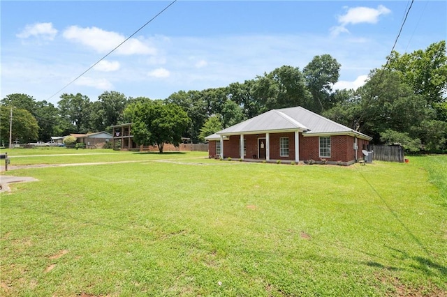 3420 Floyd Cir E, Semmes, AL 36575 - view of grassy yard featuring covered porch and view of scattered trees