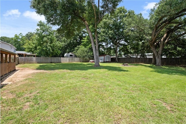 3420 Floyd Cir E, Semmes, AL 36575 - fenced backyard with a storage unit