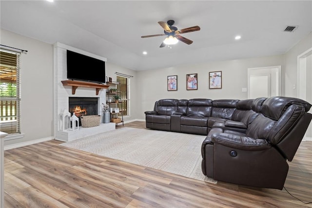 3420 Floyd Cir E, Semmes, AL 36575 - living room with a ceiling fan, a fireplace, recessed lighting, and wood finished floors