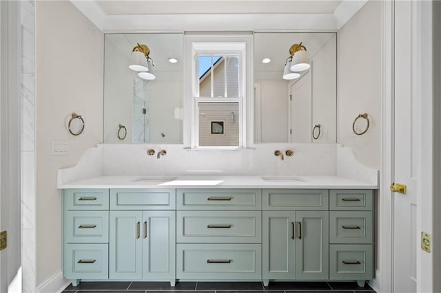 bathroom featuring a marble finish shower, double vanity, a sink, and recessed lighting