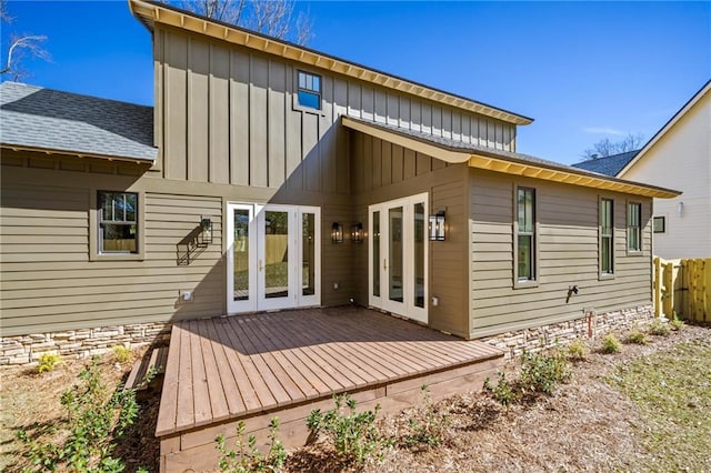 rear view of house with a deck and french doors