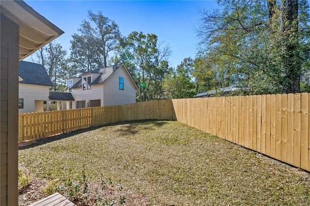 view of yard with a fenced backyard