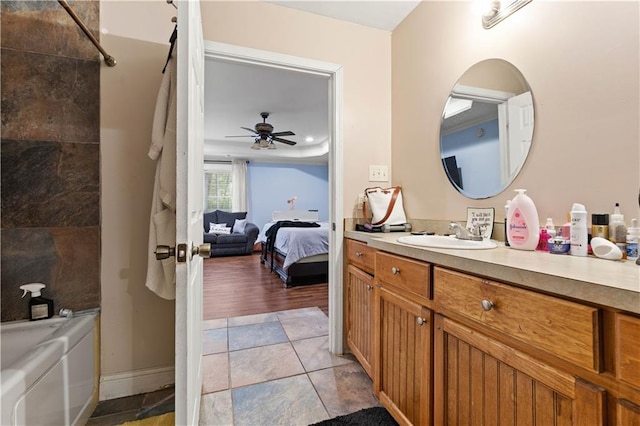 bathroom featuring vanity, ceiling fan, and hardwood / wood-style floors