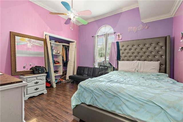 bedroom featuring a closet, ceiling fan, crown molding, and dark wood-type flooring