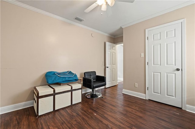 sitting room featuring dark hardwood / wood-style flooring, ornamental molding, and ceiling fan