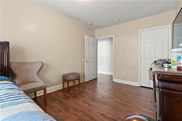 bedroom featuring dark hardwood / wood-style flooring