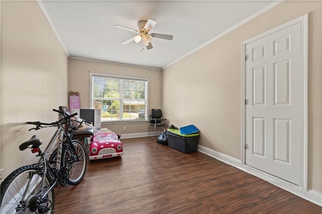 interior space with crown molding, dark wood-type flooring, and ceiling fan