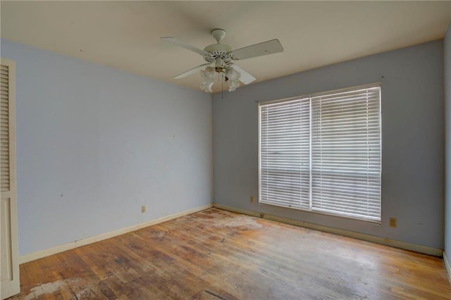 spare room featuring ceiling fan and light wood-type flooring