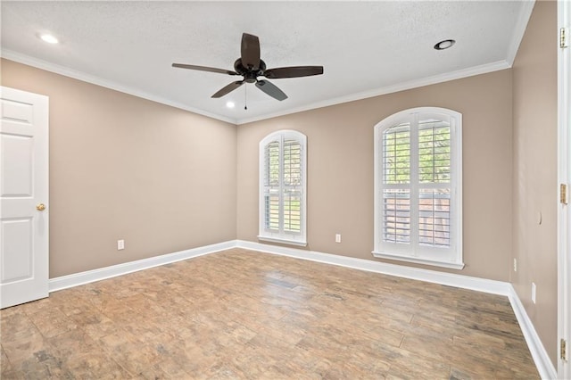 unfurnished room with a wealth of natural light, ceiling fan, a textured ceiling, and ornamental molding